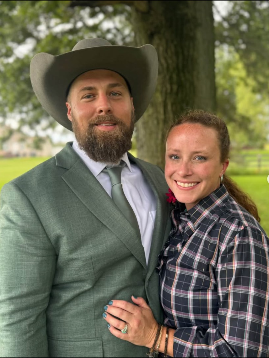 Emmie and her husband Steff under a tree on the farm
